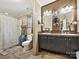 Bathroom features a double vanity, mirrors, and shower with updated faucets at 170 Louise Dr, Mooresville, NC 28115