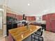 Well-equipped kitchen with wood cabinets, a butcher block island, and black appliances at 170 Louise Dr, Mooresville, NC 28115