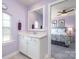 Stylish bathroom features white cabinets and vanity with a view into a cozy bedroom at 17015 River Race Dr, Huntersville, NC 28078