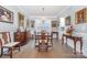 Formal dining room featuring hardwood floors, a chandelier, and elegant decor at 17015 River Race Dr, Huntersville, NC 28078