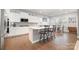 Bright kitchen with stainless appliances, hardwood floors, and a breakfast bar at 17015 River Race Dr, Huntersville, NC 28078