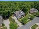 Aerial view of two-story home featuring a lush yard and three car garage at 1708 Meadow Crest Ct, Matthews, NC 28104