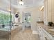 Bright bathroom features soaking tub with large windows, dual vanity, and access to bedroom at 1708 Meadow Crest Ct, Matthews, NC 28104