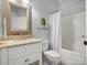 Cozy bathroom featuring a shower/tub combo, a shelf and a vanity with granite countertops at 1708 Meadow Crest Ct, Matthews, NC 28104