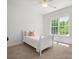 Cozy bedroom features neutral carpet, a single bed, and a window that offers natural light at 1708 Meadow Crest Ct, Matthews, NC 28104