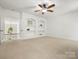 Bonus Room with shelving built-ins leading to a stairway at 1708 Meadow Crest Ct, Matthews, NC 28104
