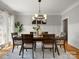 Elegant dining room with modern lighting, wood floors, and stylish decor at 1708 Meadow Crest Ct, Matthews, NC 28104