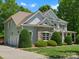 View of home showing driveway, attached two car garage, and covered front porch at 1708 Meadow Crest Ct, Matthews, NC 28104