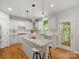 Bright kitchen featuring an island, stainless steel appliances and lots of cabinet space at 1708 Meadow Crest Ct, Matthews, NC 28104