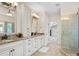 Main bathroom with and vanities, granite countertops and a glass-doored shower at 1708 Meadow Crest Ct, Matthews, NC 28104