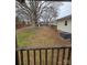 View of the backyard and fence line from the back porch at 1806 Little Rock Rd, Charlotte, NC 28214