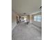 Bright living room featuring carpet flooring and walls painted in neutral colors at 1806 Little Rock Rd, Charlotte, NC 28214