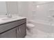 Well-lit bathroom with a shower and tub combination and modern fixtures at 210 Gilead Rd, Huntersville, NC 28078