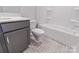 Bathroom with tub and patterned floors at 210 Gilead Rd, Huntersville, NC 28078