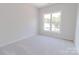 Bedroom with a large window at 210 Gilead Rd, Huntersville, NC 28078