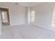 Well-lit bedroom with neutral walls, plush carpet, and ample natural light at 210 Gilead Rd, Huntersville, NC 28078
