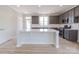 Spacious kitchen features a large center island, gray cabinets and stainless appliances at 210 Gilead Rd, Huntersville, NC 28078