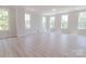 A light-filled open-concept living space featuring lots of large windows at 210 Gilead Rd, Huntersville, NC 28078