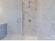 Modern walk-in shower with sleek glass door and marble-style tile surround at 210 Gilead Rd, Huntersville, NC 28078
