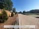 Paver street lined with trees and landscaping in a new community at 210 Gilead Rd, Huntersville, NC 28078