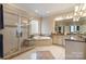 Elegant bathroom featuring a glass shower, soaking tub, double vanity, and granite countertops at 2379 Metcalf Dr, Sherrills Ford, NC 28673