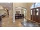 Elegant dining room with hardwood floors, chandelier, and an archway to the main entry at 2379 Metcalf Dr, Sherrills Ford, NC 28673