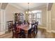 Traditional dining room featuring a wood table, chairs, hardwood floors, a chandelier, and a decorative cabinet at 2379 Metcalf Dr, Sherrills Ford, NC 28673