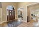 Grand foyer with soaring ceilings, arched doorway, hardwood floors, and beautiful front door at 2379 Metcalf Dr, Sherrills Ford, NC 28673