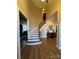 Elegant foyer with a curved staircase, hardwood floors, and high ceilings at 2379 Metcalf Dr, Sherrills Ford, NC 28673