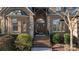 Inviting front entrance featuring a brick stairway, arched entryway, brick and stone pillars at 2379 Metcalf Dr, Sherrills Ford, NC 28673