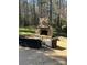 Stone outdoor fireplace with furniture on a brick patio at 2379 Metcalf Dr, Sherrills Ford, NC 28673