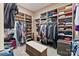 Organized walk-in closet with custom shelving, hanging racks, and a central storage bench at 2379 Metcalf Dr, Sherrills Ford, NC 28673