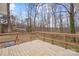 Spacious wooden deck, perfect for outdoor dining and relaxation with lovely trees in the backyard at 2407 Moose Rd, Kannapolis, NC 28083