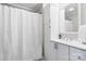 Bathroom featuring white cabinets, a sink, a mirror, and a shower at 2407 Moose Rd, Kannapolis, NC 28083