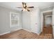 Bedroom featuring ceiling fan, wood-look floors, and a window at 2407 Moose Rd, Kannapolis, NC 28083