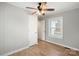 Bright bedroom with wood-look floors, a window, and ceiling fan at 2407 Moose Rd, Kannapolis, NC 28083