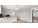 Dining room features hardwood floors, neutral walls, and modern lighting fixtures at 2407 Moose Rd, Kannapolis, NC 28083