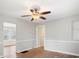 Spacious living room with hardwood floors, neutral walls, and a ceiling fan at 2407 Moose Rd, Kannapolis, NC 28083