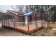 Large wood deck with white railings and stairs leading to the yard at 3272 Hunter Ridge Rd, Rock Hill, SC 29732