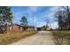 Wide view of a ranch-style house with a gravel driveway leading to the home at 3272 Hunter Ridge Rd, Rock Hill, SC 29732