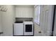 Practical laundry room with a washer, dryer, storage cabinets, and a window at 3272 Hunter Ridge Rd, Rock Hill, SC 29732