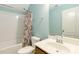 Bathroom with shower-tub combo, toilet, and sink with large mirror at 3960 Franklin Meadows Dr, Matthews, NC 28105