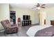 Bedroom featuring a ceiling fan, TV, lounge chair, and closet space at 3960 Franklin Meadows Dr, Matthews, NC 28105