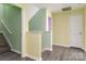 Upstairs hallway painted in contrasting colors with multiple doorways and wood floors at 3960 Franklin Meadows Dr, Matthews, NC 28105