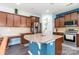 Spacious kitchen island featuring granite countertops, wood cabinets, and modern appliances at 3960 Franklin Meadows Dr, Matthews, NC 28105