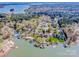 An aerial view of a lakeside community with lush trees and a scenic lake at 4907 White Oak Ln, Denver, NC 28037