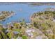 An aerial view of a lakeside homes and community, surrounded by lush trees and a scenic lake at 4907 White Oak Ln, Denver, NC 28037