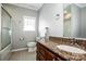 Bathroom featuring a vanity with granite countertop, tub with shower, and tile flooring at 4907 White Oak Ln, Denver, NC 28037