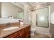 Bathroom features a vanity with granite countertop, a shower-tub combo, and neutral walls at 4907 White Oak Ln, Denver, NC 28037