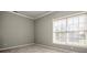 Cozy bedroom with neutral walls, carpeting, crown molding, and a window with natural light at 4907 White Oak Ln, Denver, NC 28037